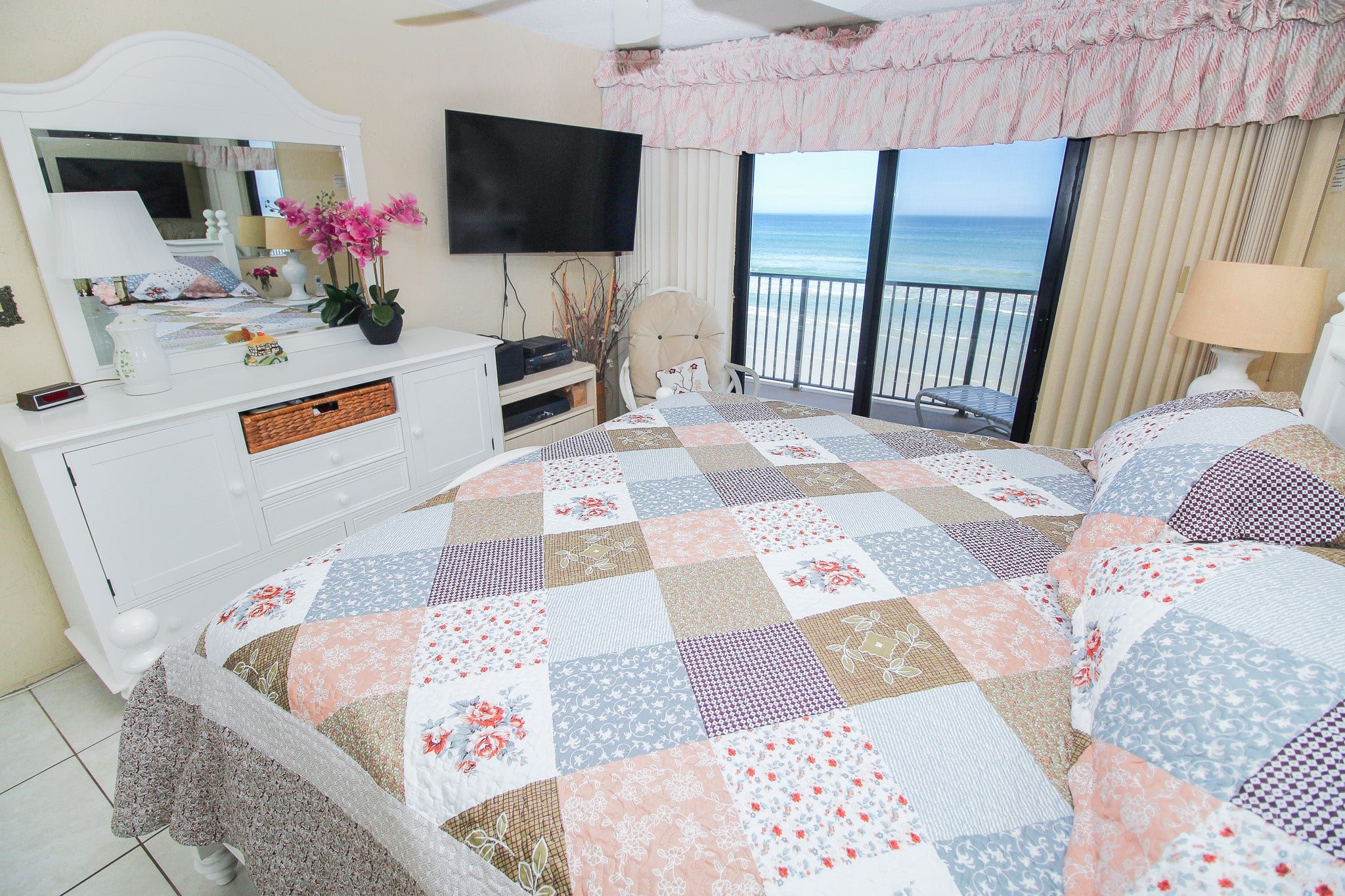 Tv & ocean view in primary bed