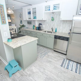 Kitchen with white & sage green cabinets