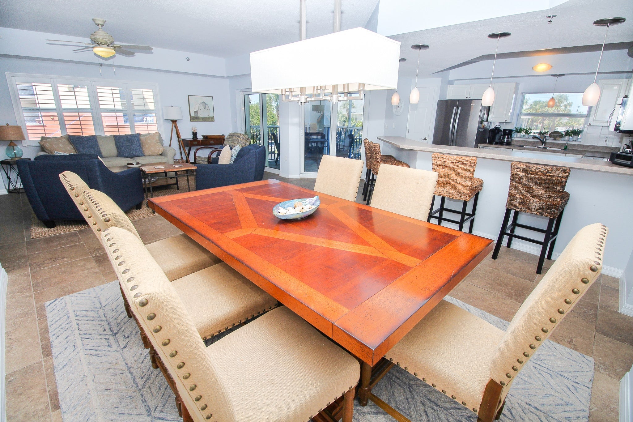 Large dining table in open-concept condo