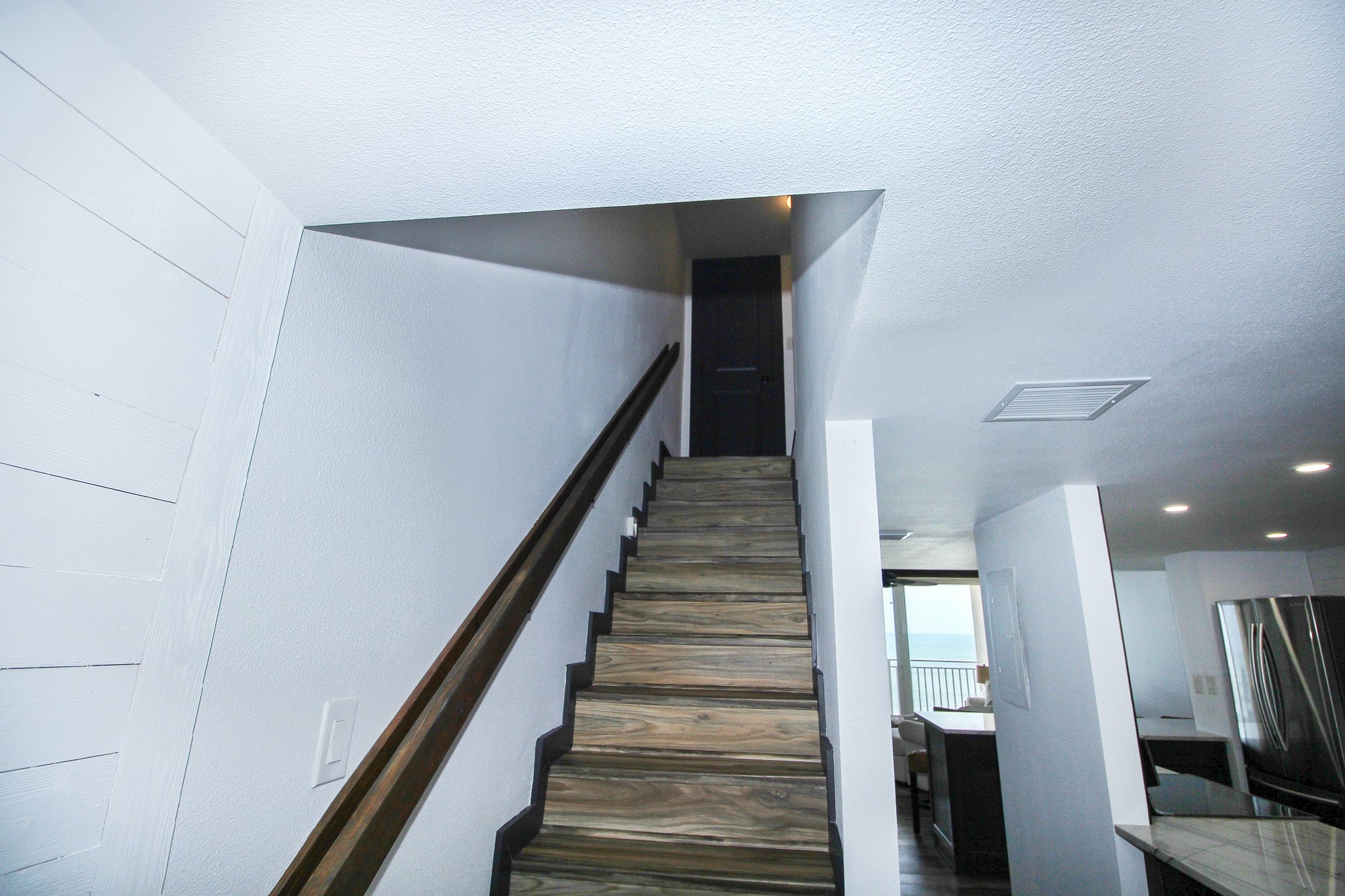 Staircase leads to bedrooms