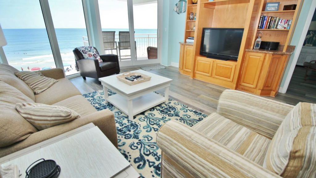 furnished living room with stunning view of ocean