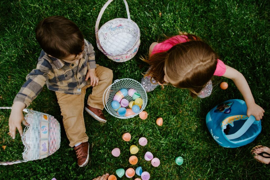 two young children at an easter egg hunt